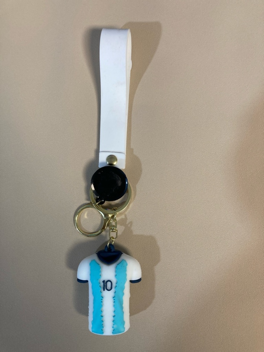& Other Stories White Strap Keychain with Blue and Black Jersey Charm